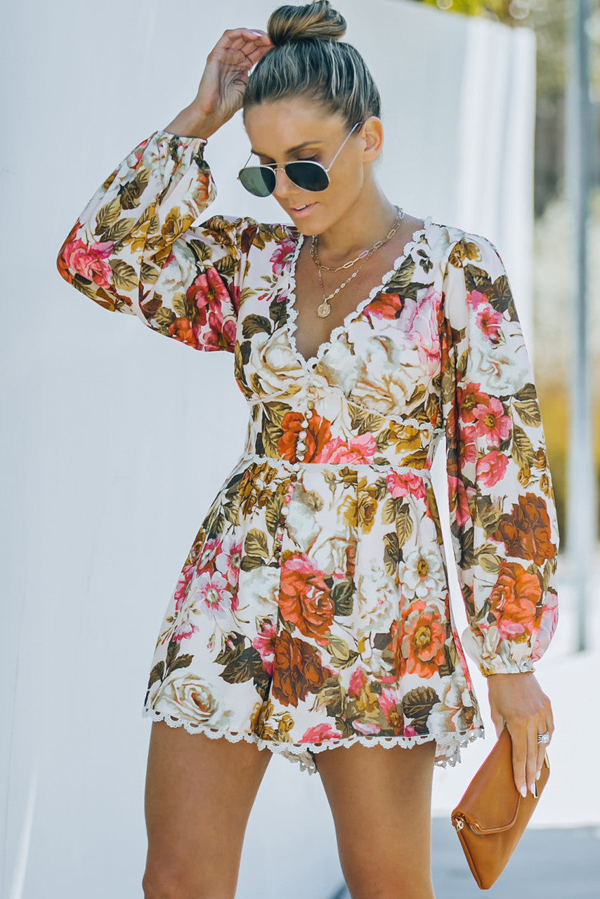 V-neck floral print romper with bishop sleeves and lace trim