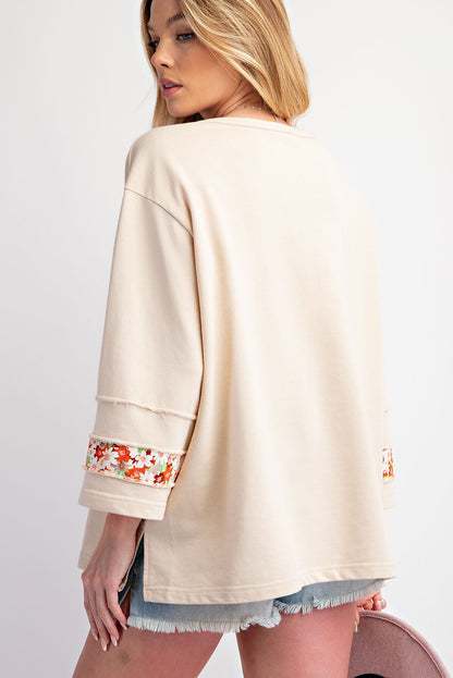 Flower Patch Graphic Exposed Seam Wide Sleeve Top