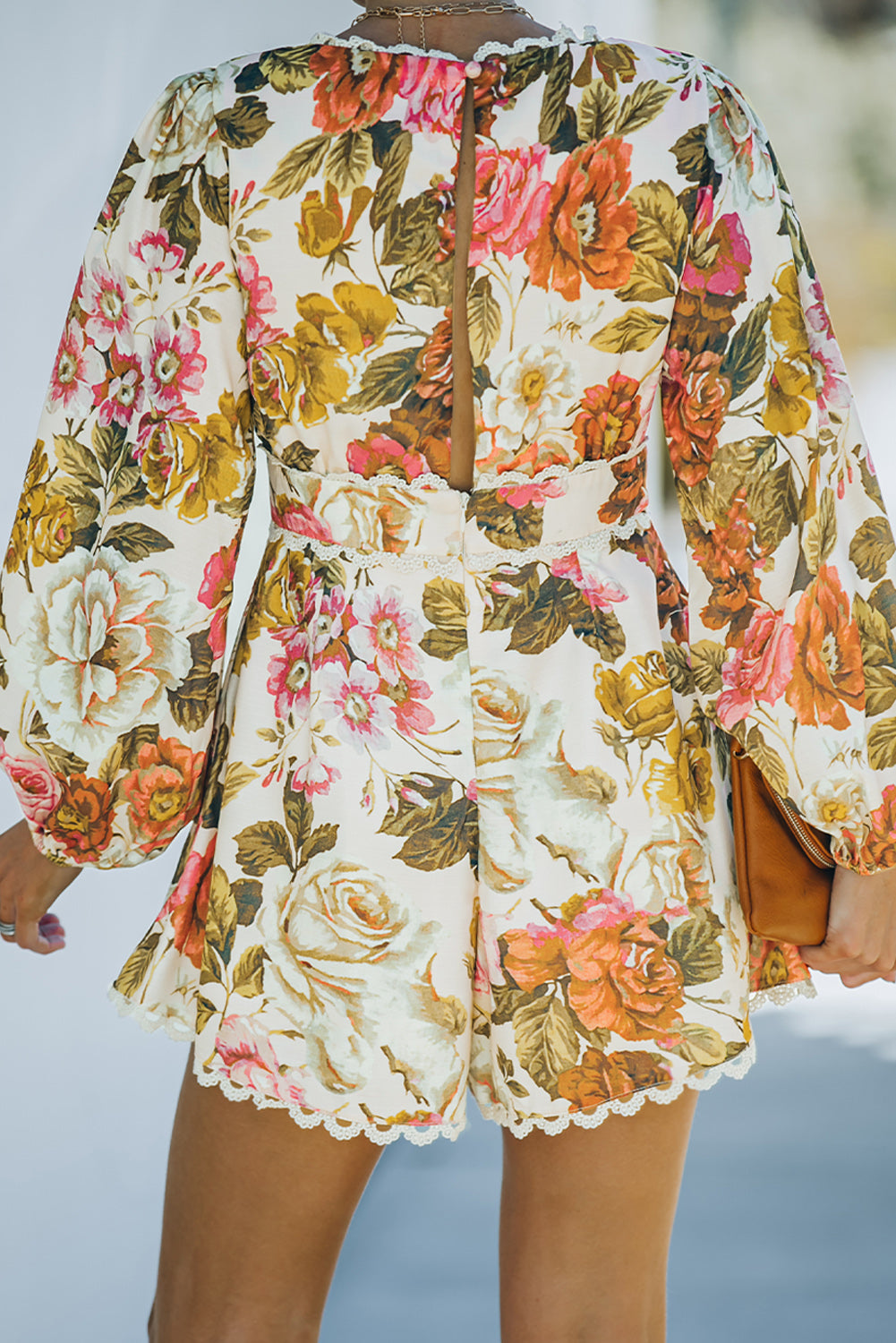 V-neck floral print romper with bishop sleeves and lace trim